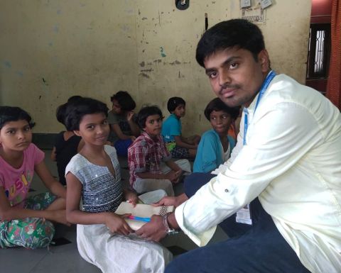 Raybiztech distributing books to kids Raybiztech distributing books to kids