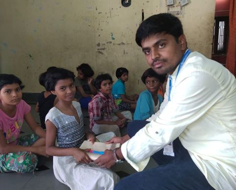 Raybiztech distributing books to kids